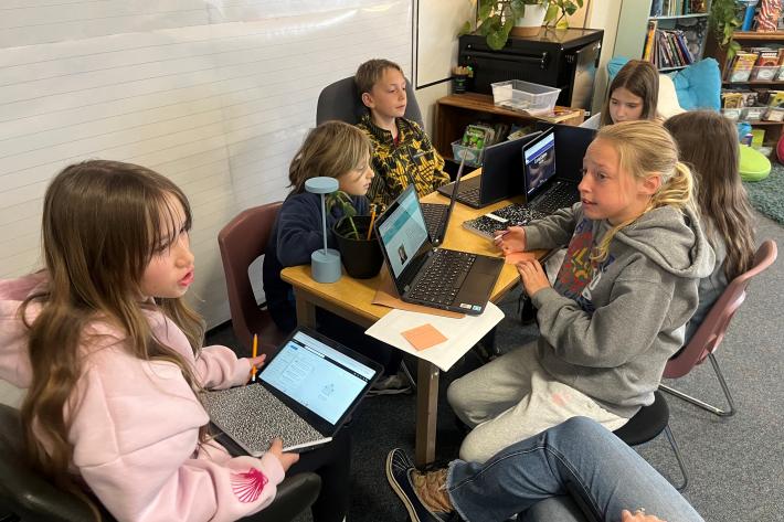 McGraw 5th Graders collaborate about how to serve their community through their IB Exhibition projects