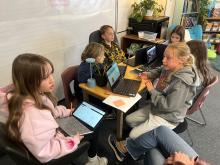 McGraw 5th Graders collaborate about how to serve their community through their IB Exhibition projects